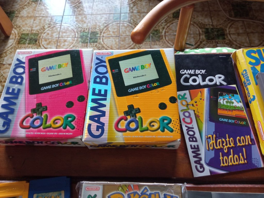 Two Game Boy Color boxes and some manuals.